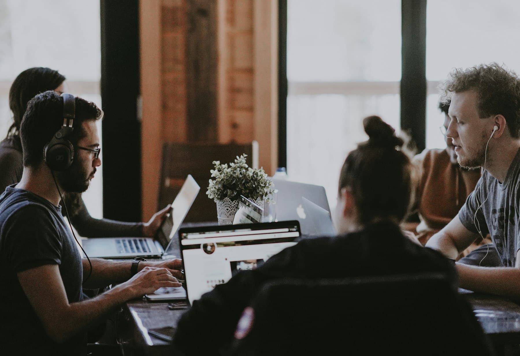 A team collaborating in a bright workshop space